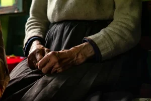 Blog 1 senior hands resting on skirt in somber light 2026 01 06 09 29 23 utc
